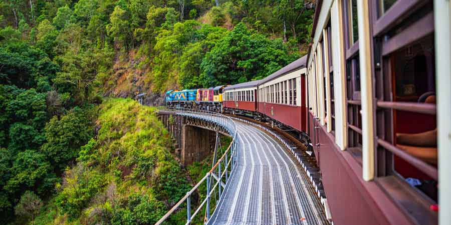 Riding the Kuranda Scenic Railway into a rainforest
